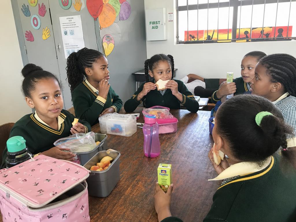 Girls enjoying healthy snacks together